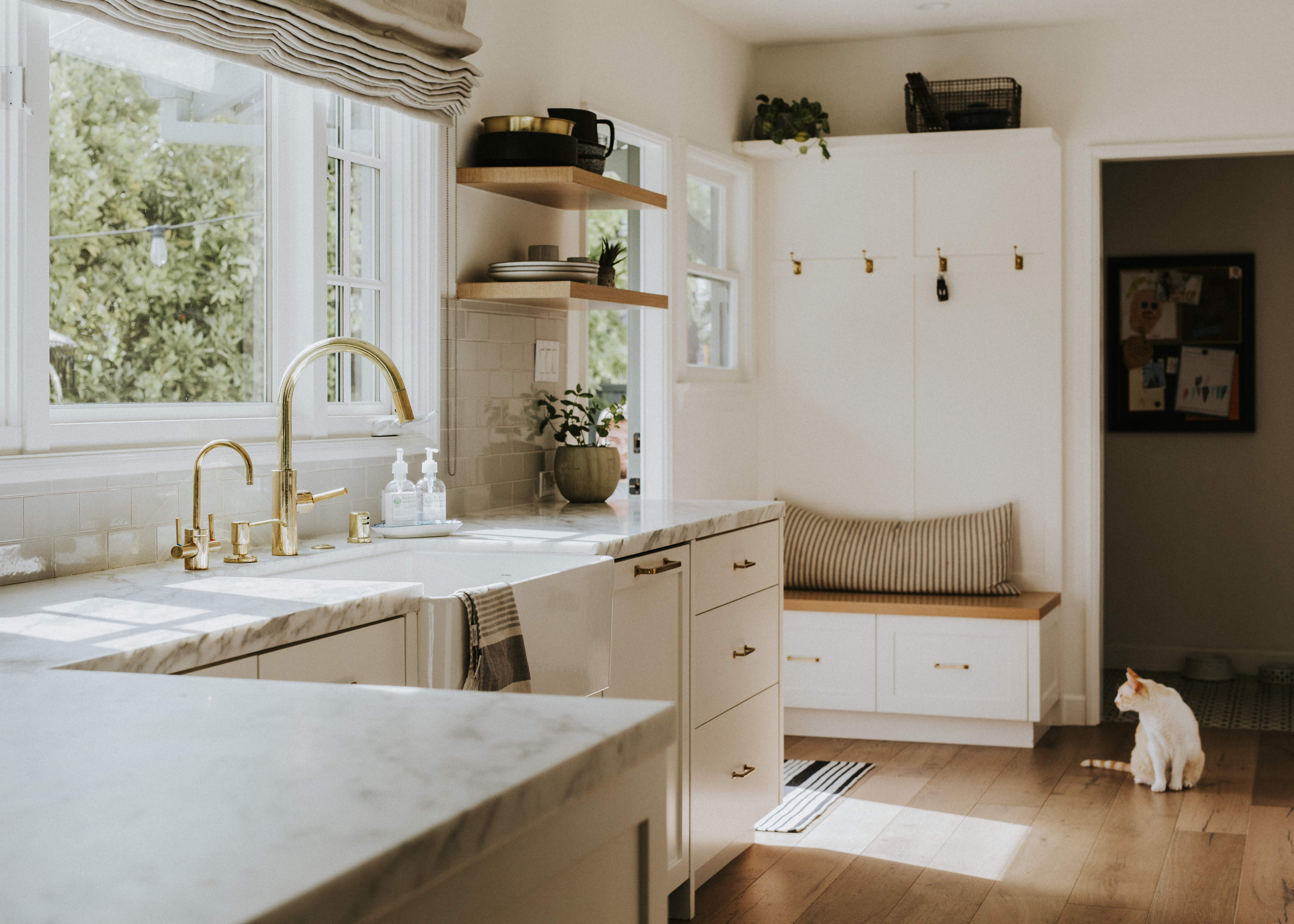 Modern renovated kitchen with warm wood cabinets and quartz countertops